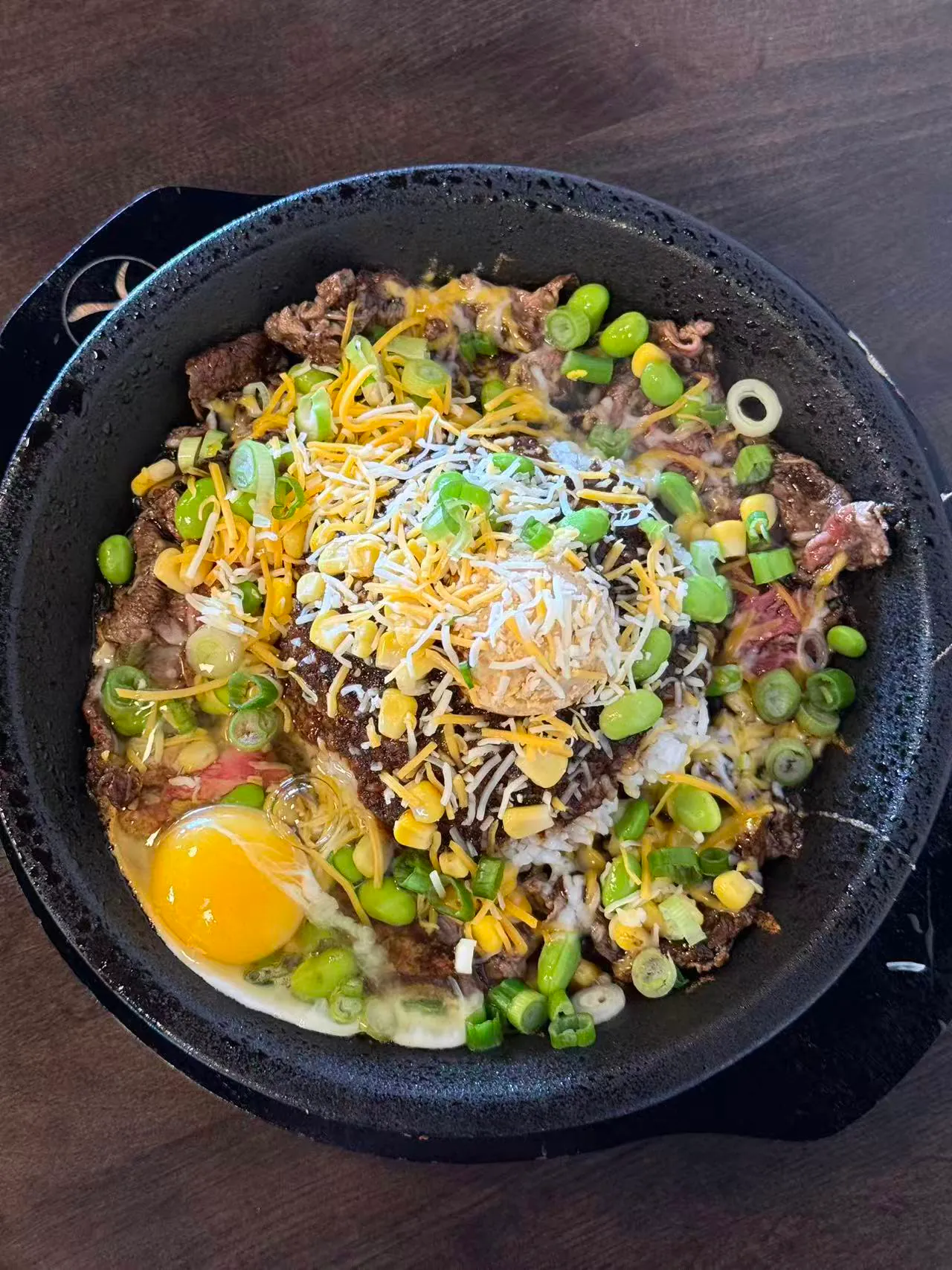 Sizzling beef rice bowl with egg, cheese and edamame at Tasty Pot, a Taiwanese Restaurant in Redding