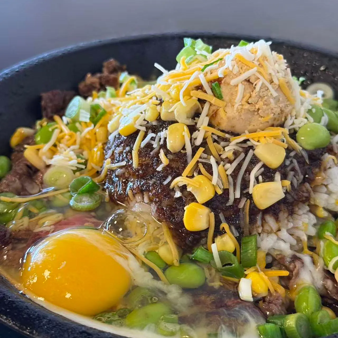 Sizzling beef rice bowl with egg, cheese and corn at Tasty Pot, a Taiwanese Restaurant in Redding