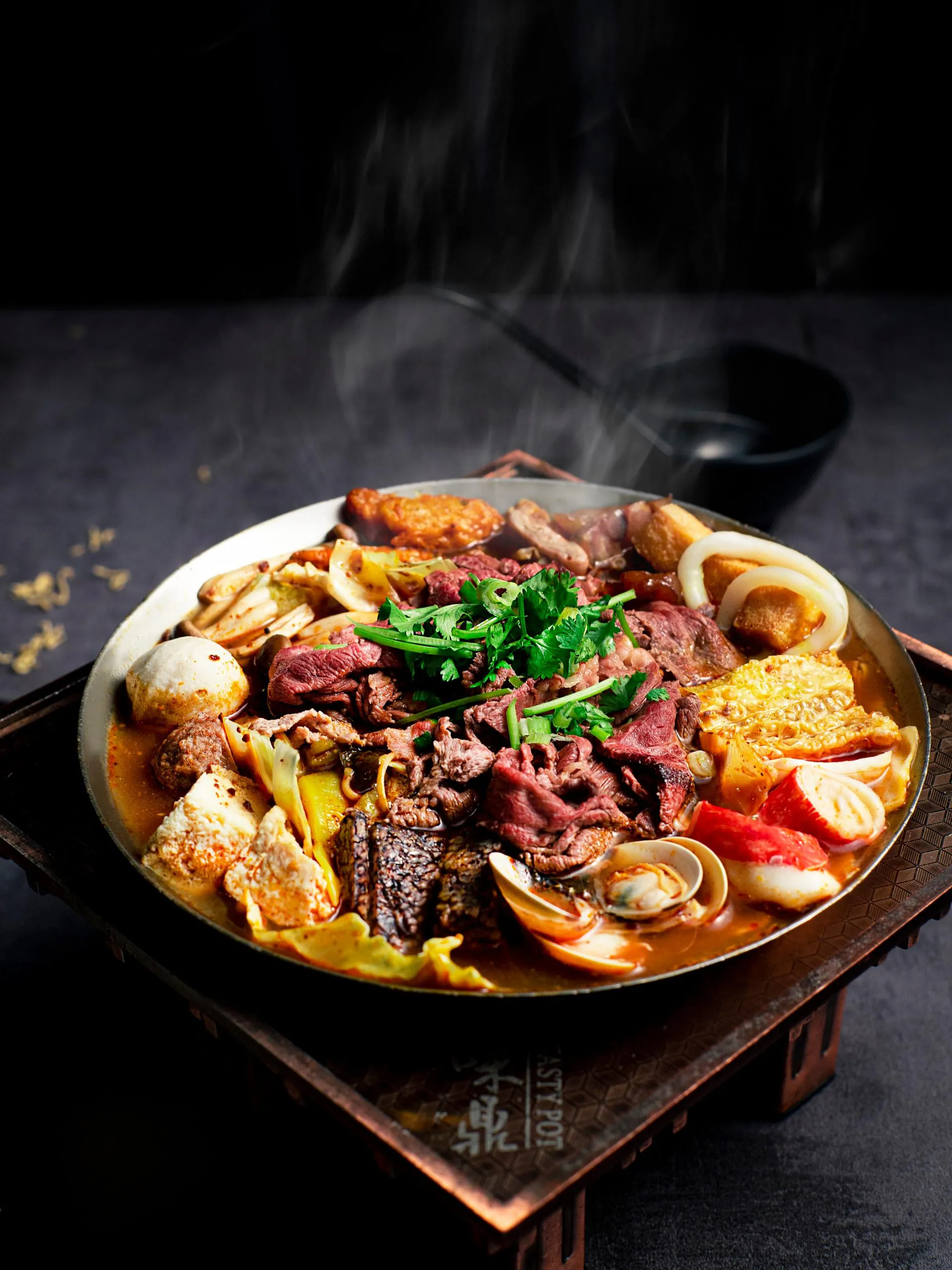 Spicy beef hot pot with assorted meatballs and seafood at Tasty Pot, a Taiwanese Restaurant in Redding